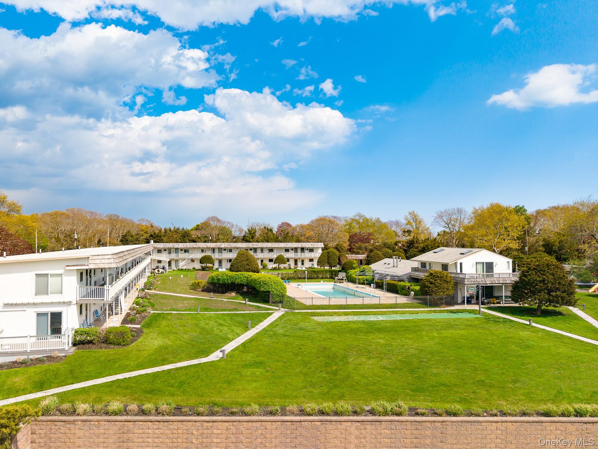 50 Rampasture Road, Unit 6 Hampton Bays, NY 11946 - Photo 1 of 35 a view of a city