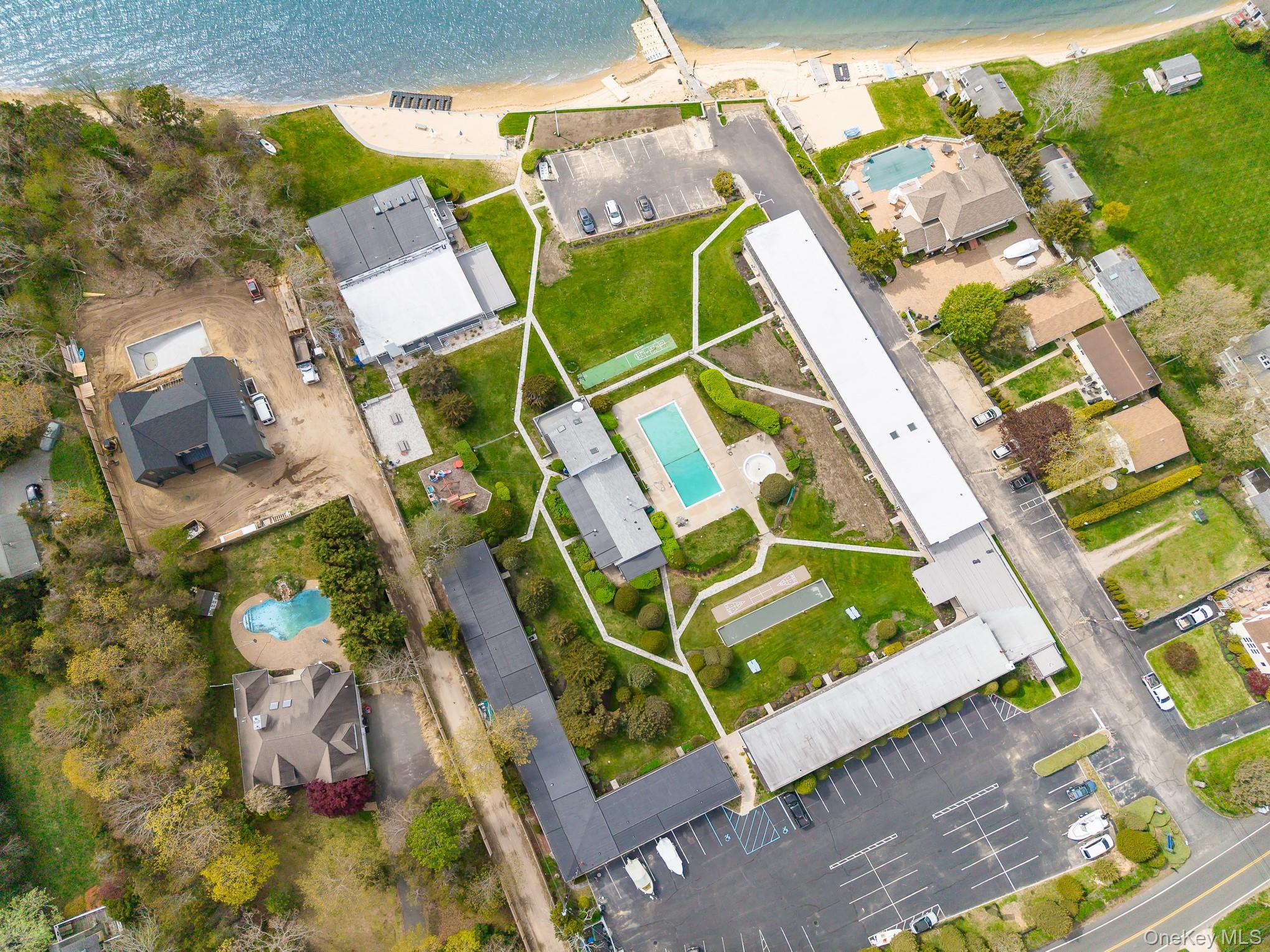 50 Rampasture Road, Unit 6 Hampton Bays, NY 11946 - Photo 13 of 35 an aerial view of a backyard with a table and chairs