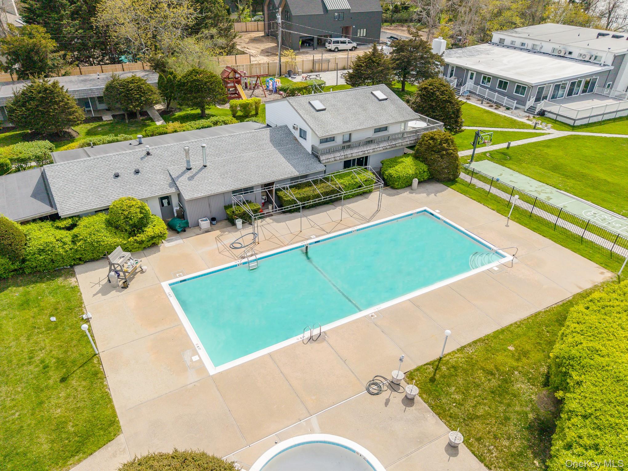 50 Rampasture Road, Unit 6 Hampton Bays, NY 11946 - Photo 15 of 35 an aerial view of a house