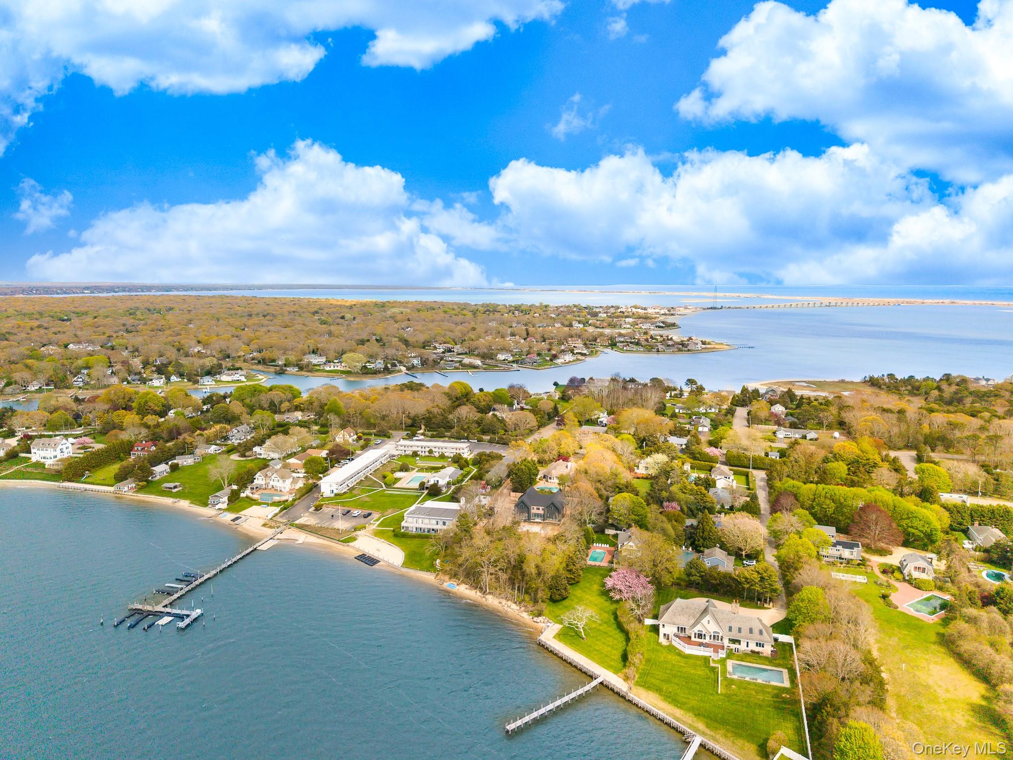 50 Rampasture Road, Unit 6 Hampton Bays, NY 11946 - Photo 4 of 35 an aerial view of residential houses with outdoor space