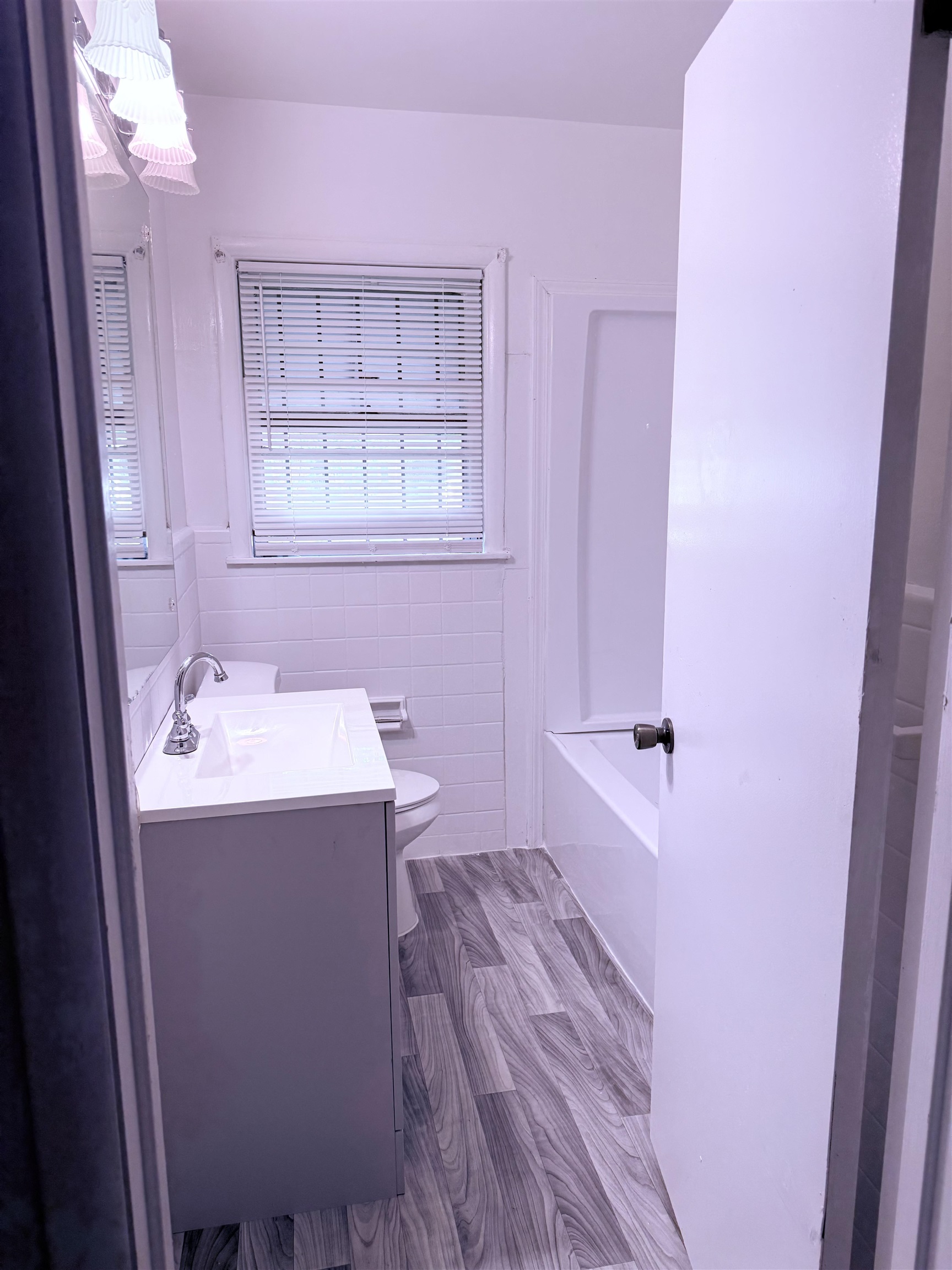 4089 Tessland Road Memphis, TN 38128 - Photo 12 of 34 Full bathroom with vanity, tile walls, and a tub to relax in