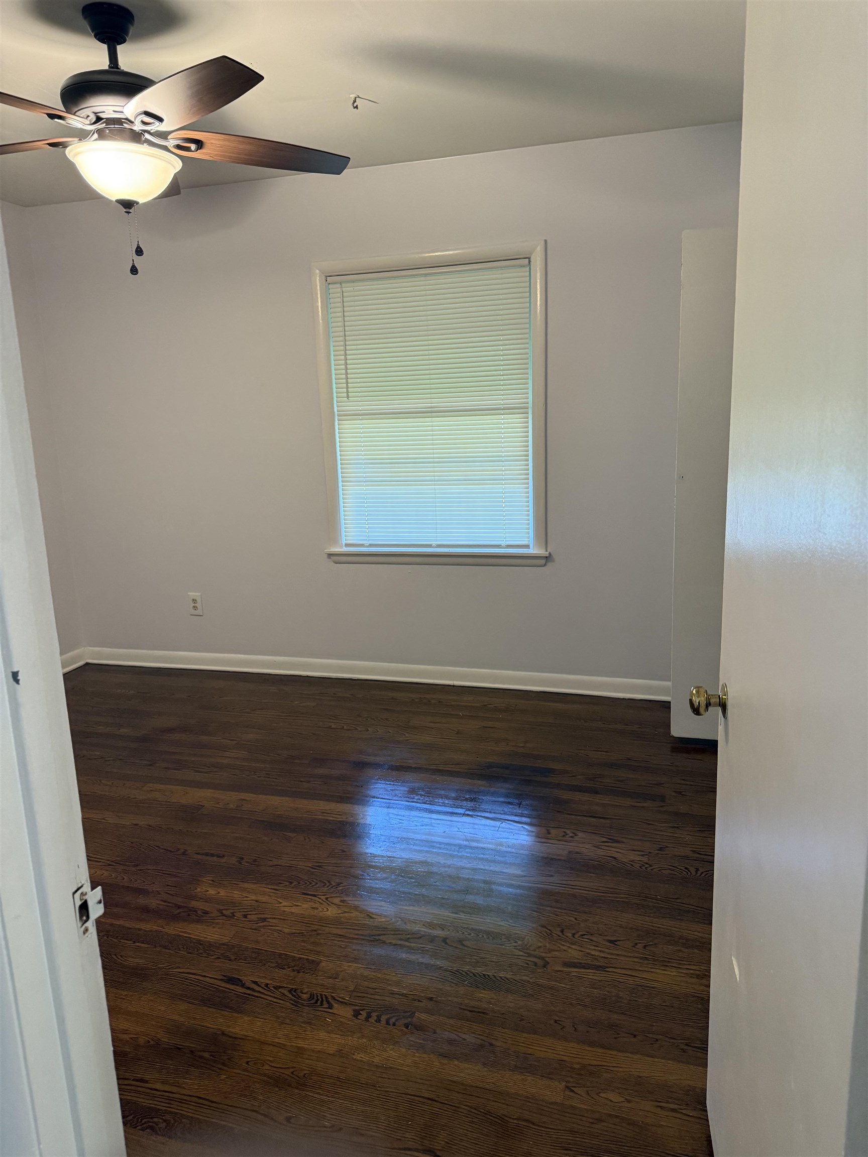 4089 Tessland Road Memphis, TN 38128 - Photo 18 of 34 Empty room with a ceiling fan and dark wood-type flooring
