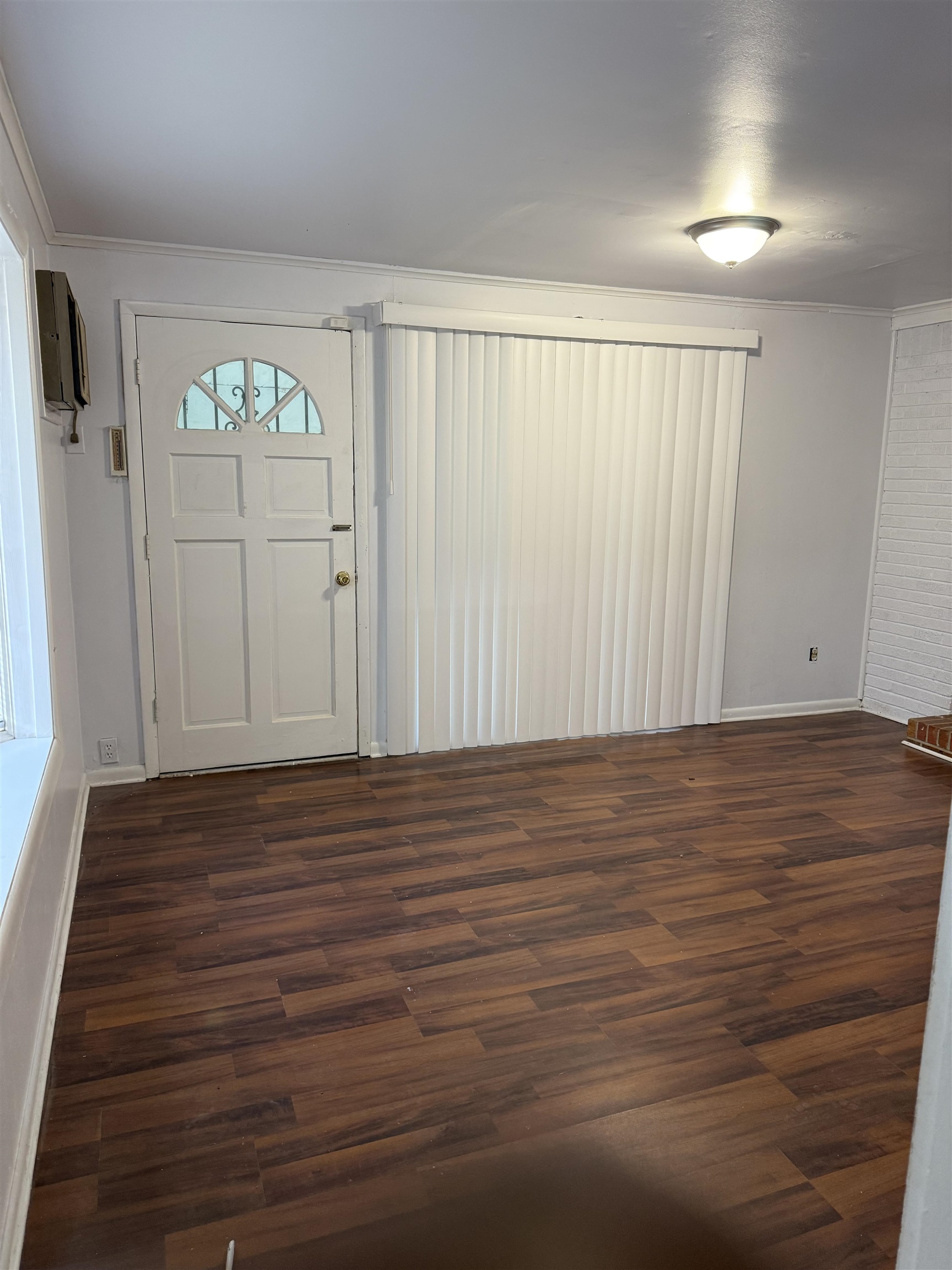 4089 Tessland Road Memphis, TN 38128 - Photo 26 of 34 Entryway with dark wood finished floors, a wall mounted AC, and ornamental molding
