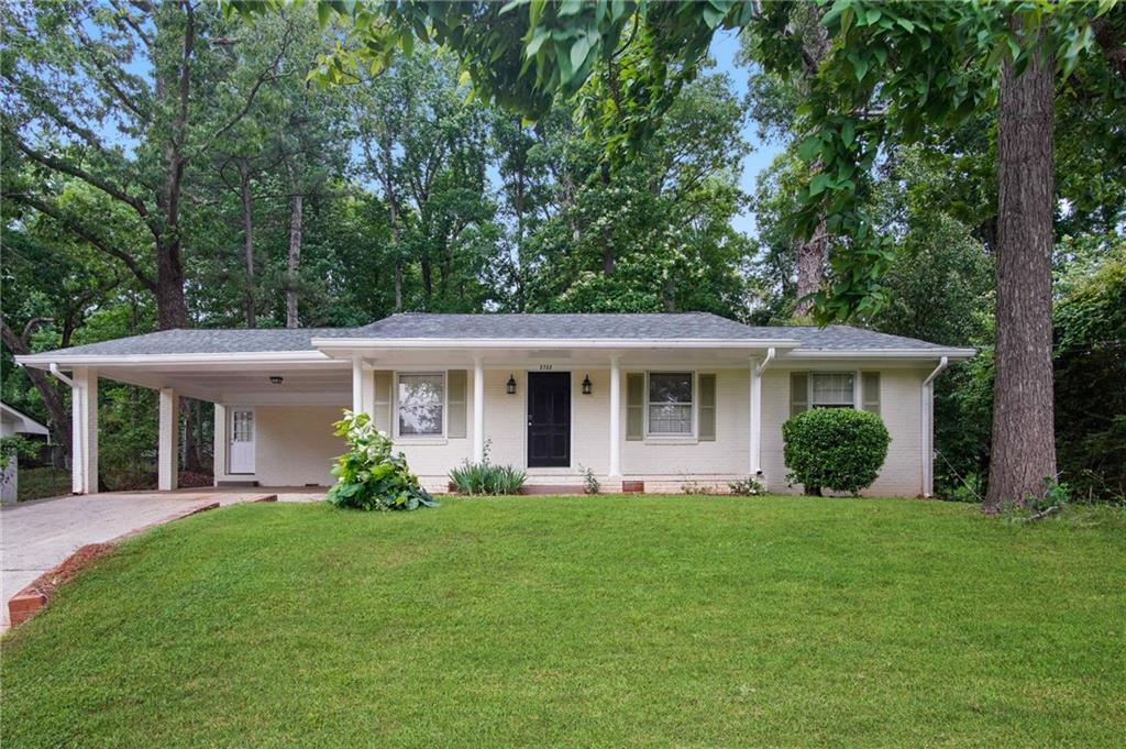 2732 Elkhorn Drive Decatur, GA 30034 - Photo 1 of 1 a front view of a house with a yard and potted plants