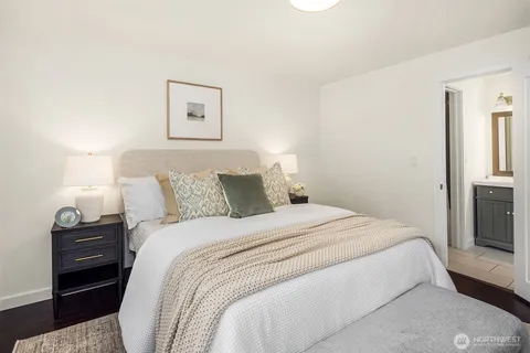 a bedroom with a bed and a couch