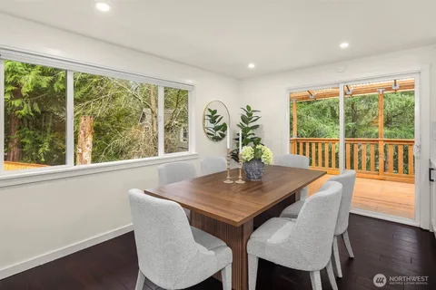 a view of a dining room with furniture window and wooden floor