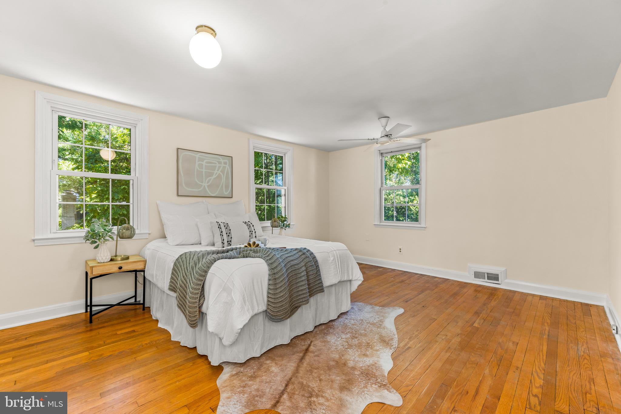 2926 Placid Avenue Baltimore, MD 21234 - Photo 29 of 37 a spacious bedroom with a bed and a window