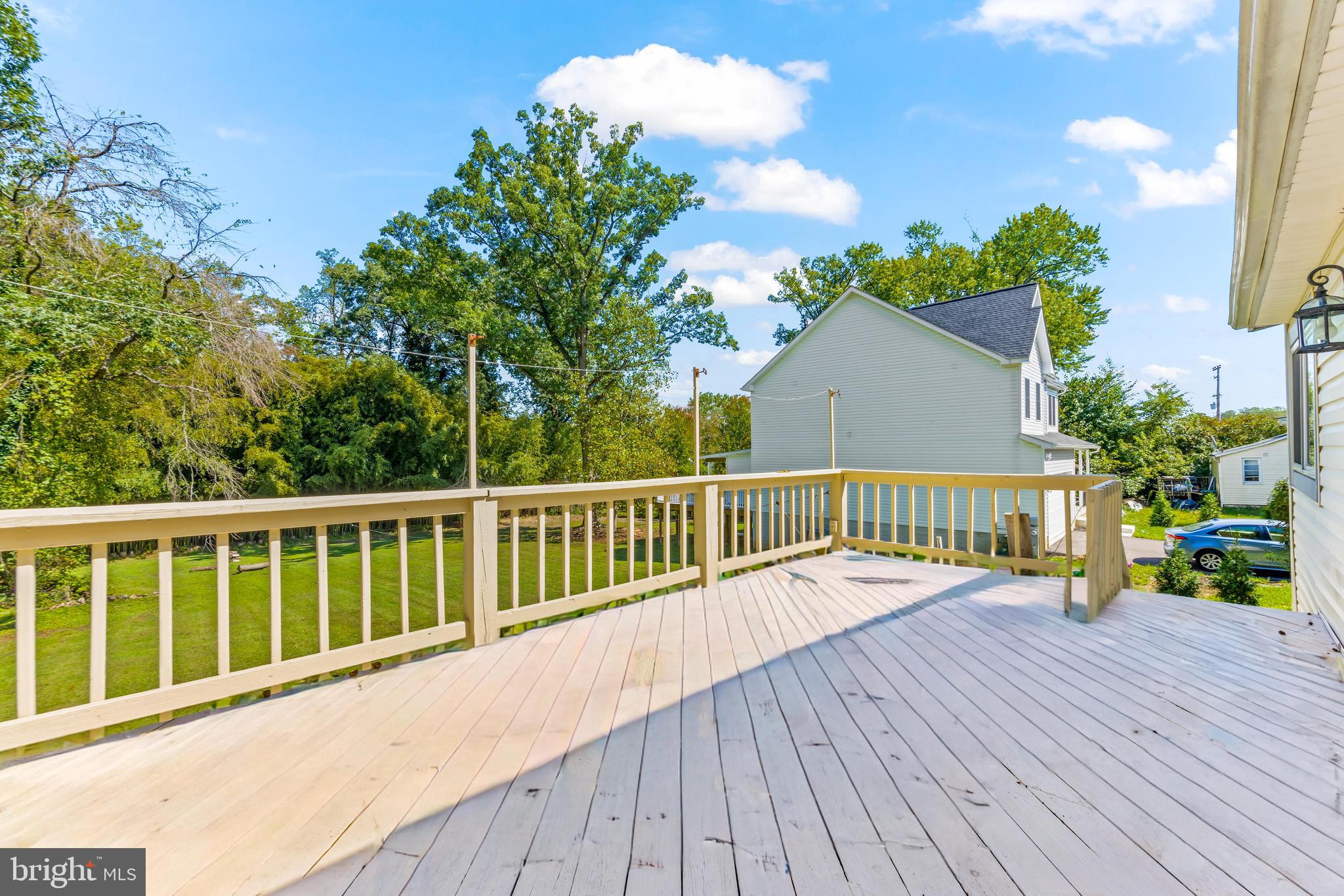 2926 Placid Avenue Baltimore, MD 21234 - Photo 32 of 37 a view of a balcony with wooden floor and fence