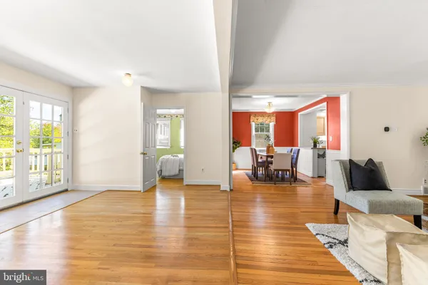 a living room with furniture and large windows