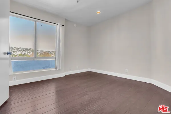 a room with a sink and a mirror