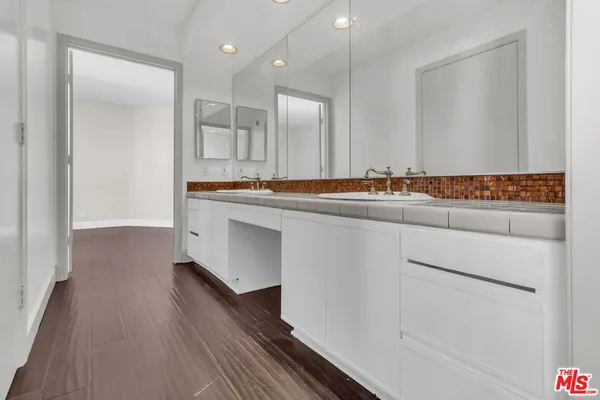 a bathroom with a toilet and bathtub