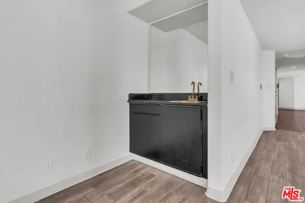 a kitchen with stainless steel appliances granite countertop a stove and a refrigerator