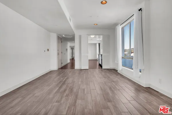 a kitchen with stainless steel appliances white cabinets and a sink