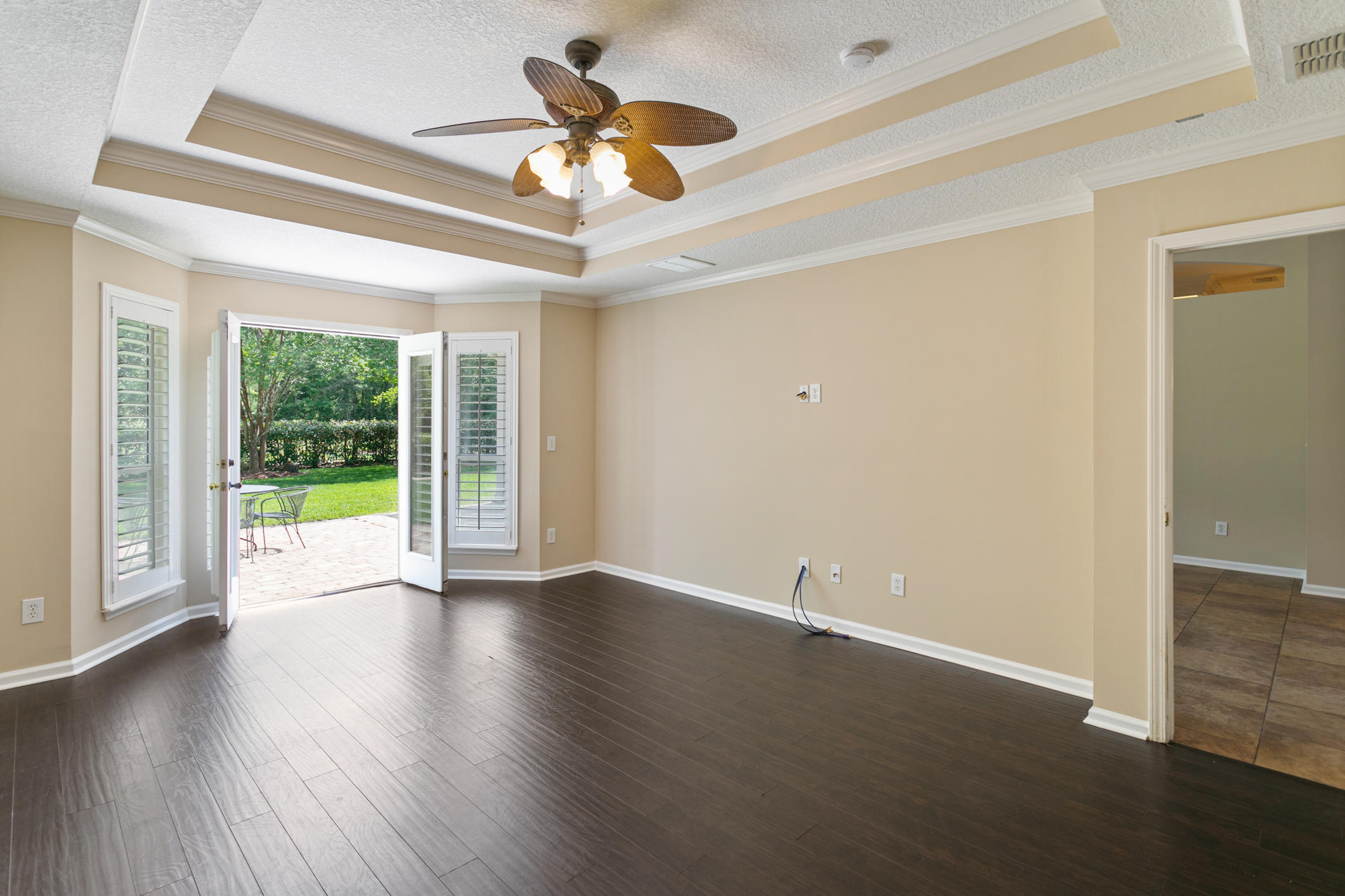 1277 Ribbon Road St. Johns, FL 32259 - Photo 18 of 44 a view of an empty room with wooden floor and a ceiling fan