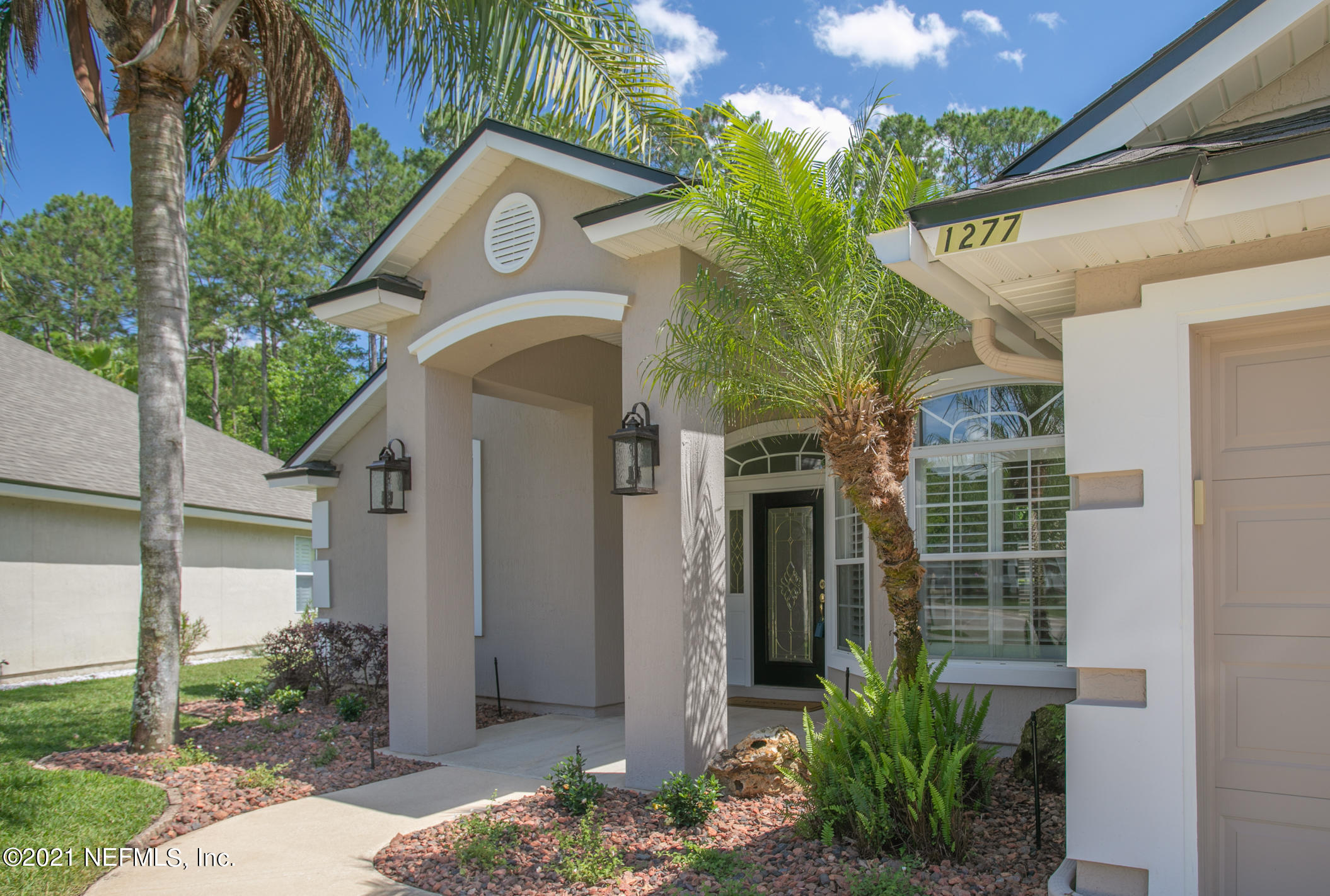 1277 Ribbon Road St. Johns, FL 32259 - Photo 2 of 44 a front view of a house with garden