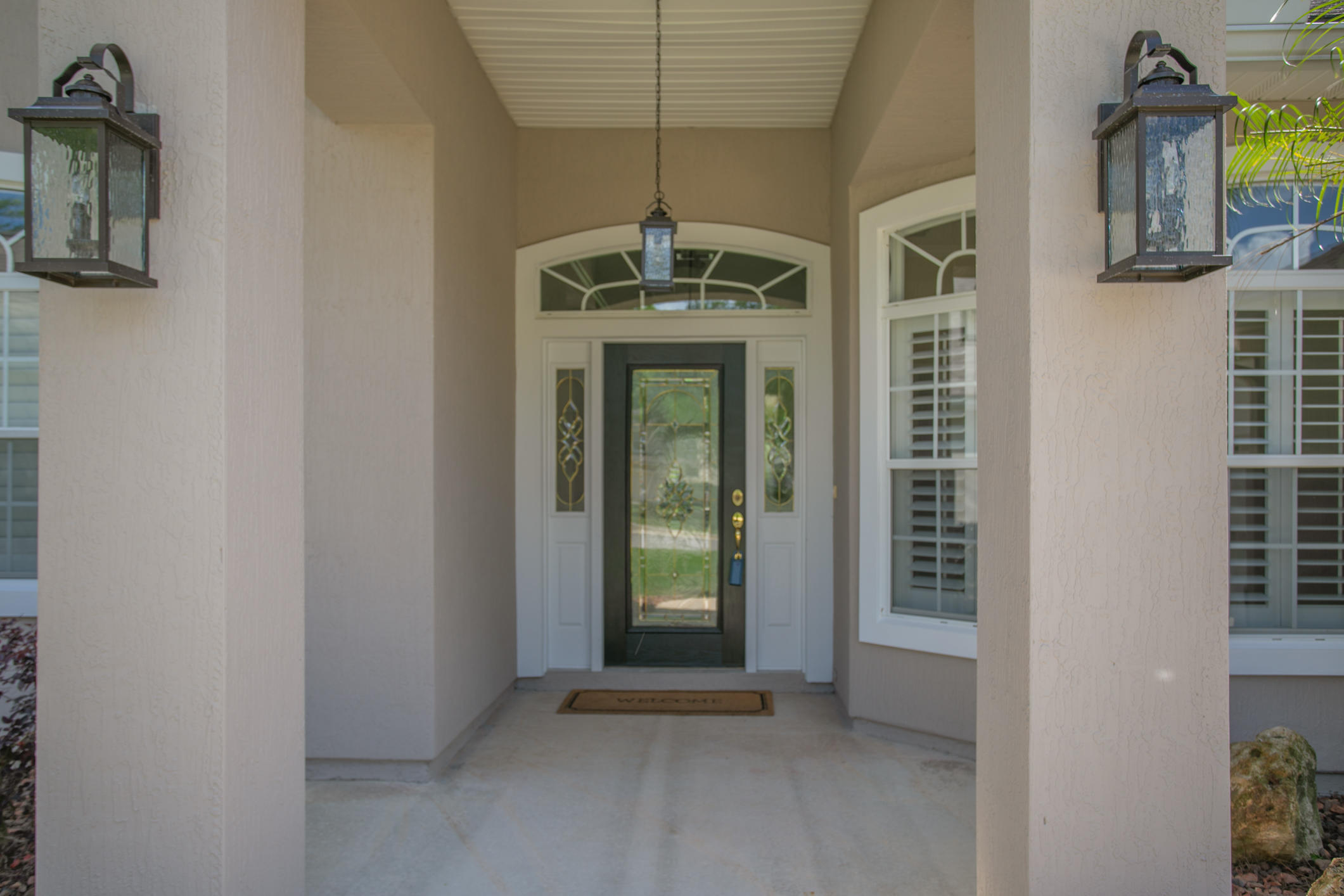 1277 Ribbon Road St. Johns, FL 32259 - Photo 3 of 44 a view of a hallway with windows and chandelier