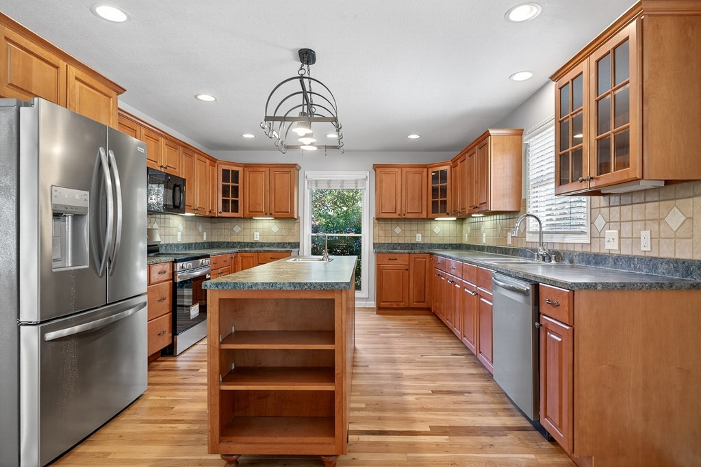 1325 Bridle Path Cookeville, TN 38501 - Photo 12 of 41 a kitchen with stainless steel appliances granite countertop a refrigerator and a sink