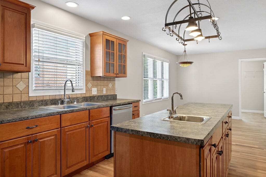 1325 Bridle Path Cookeville, TN 38501 - Photo 14 of 41 a kitchen with granite countertop a sink cabinetry and stove