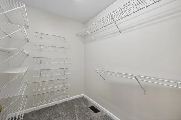 a view of an empty walk in closet