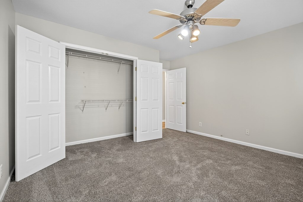 1325 Bridle Path Cookeville, TN 38501 - Photo 25 of 41 an empty room with closet and a ceiling fan
