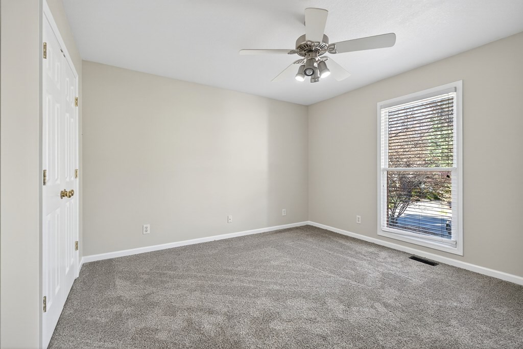 1325 Bridle Path Cookeville, TN 38501 - Photo 28 of 41 an empty room with windows and fan