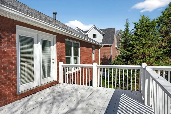 a view of a brick house with a large window