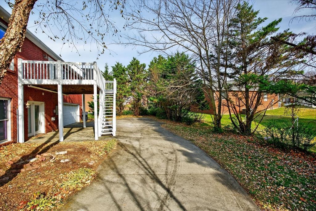 1325 Bridle Path Cookeville, TN 38501 - Photo 41 of 41 a view of a house with a large tree and a yard
