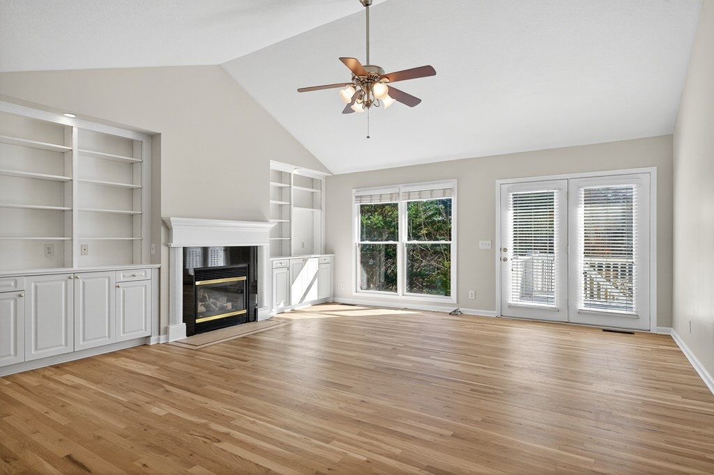1325 Bridle Path Cookeville, TN 38501 - Photo 5 of 41 a view of a livingroom with a ceiling fan fireplace and wooden floor