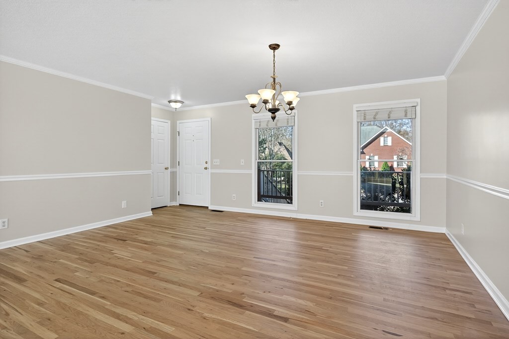 1325 Bridle Path Cookeville, TN 38501 - Photo 6 of 41 an empty room with wooden floor mirror and windows