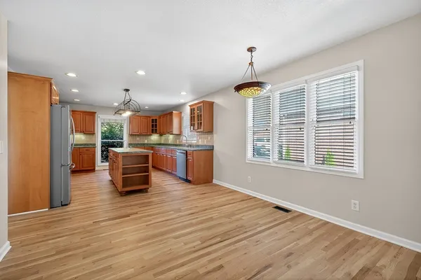 a view of kitchen with wooden floor and window