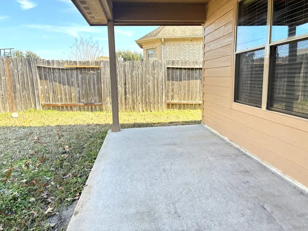 a swimming pool with wooden fence