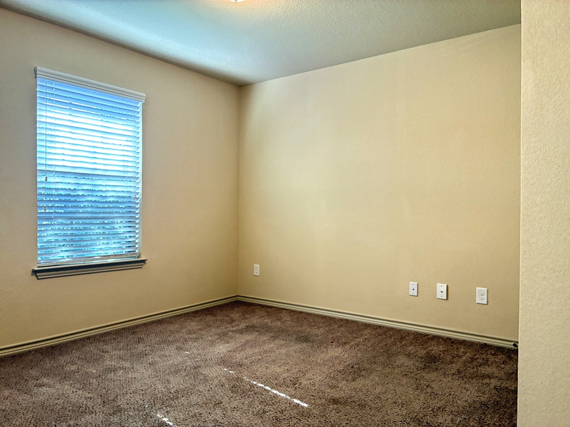 19063 Painted Boulevard Porter, TX 77365 - Photo 5 of 23 a view of an empty room and a window