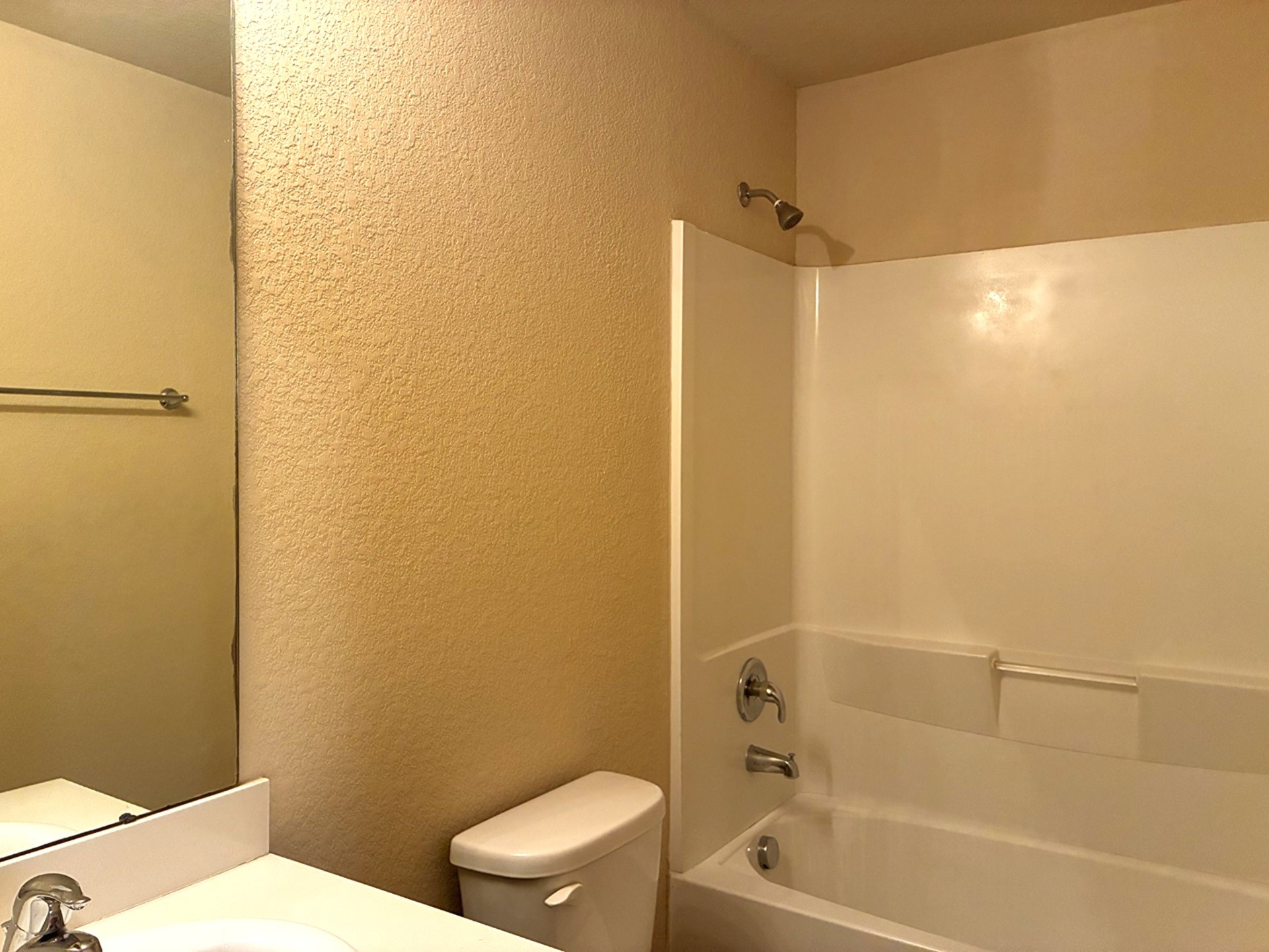19063 Painted Boulevard Porter, TX 77365 - Photo 6 of 23 a bathroom with a bathtub and a toilet