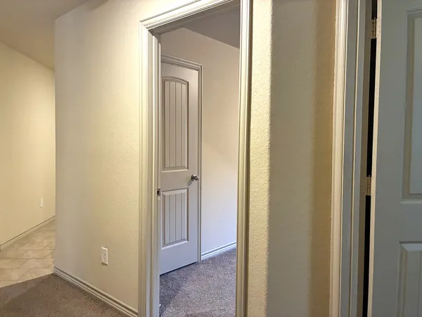 a view of a bathroom from the door