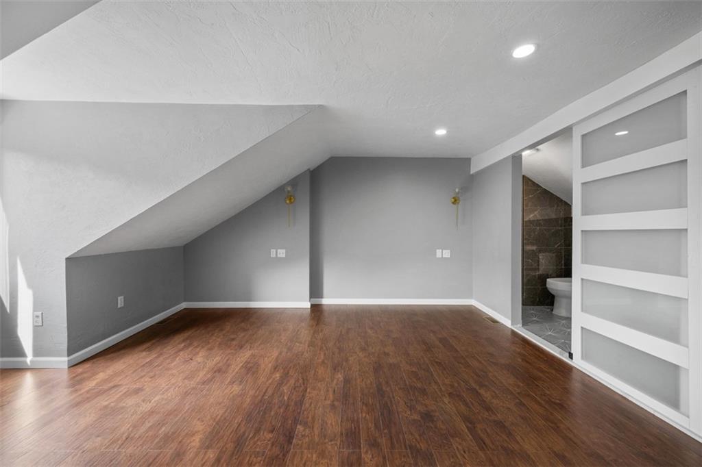 3943 Howley Street Pittsburgh, PA 15224 - Photo 19 of 32 a view of an empty room with wooden floor and closet