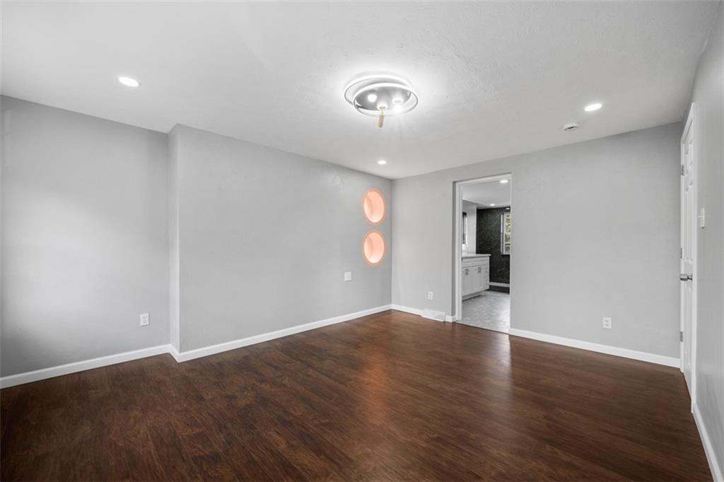 3943 Howley Street Pittsburgh, PA 15224 - Photo 9 of 32 an empty room with wooden floor and window