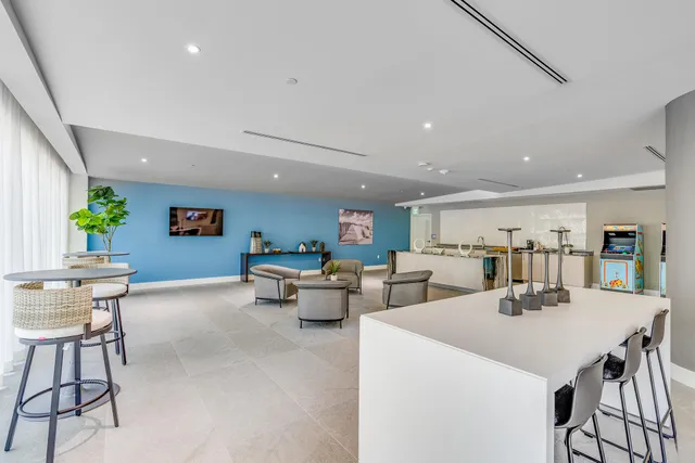 a kitchen with a table and chairs in it