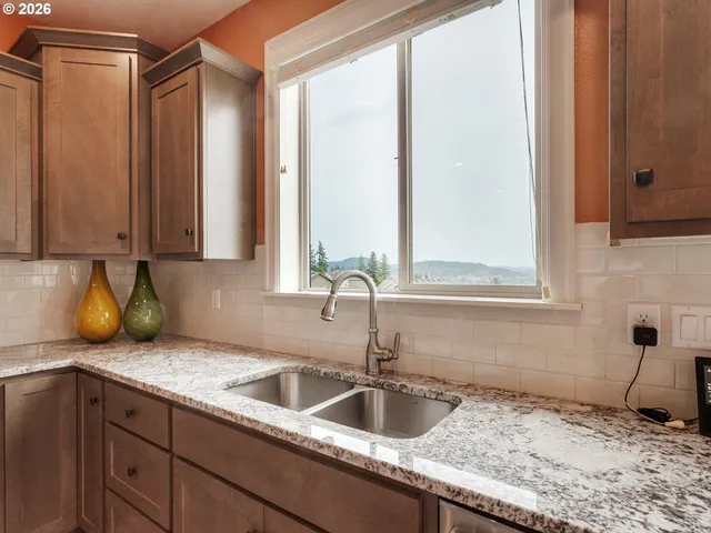 a kitchen with sink and window