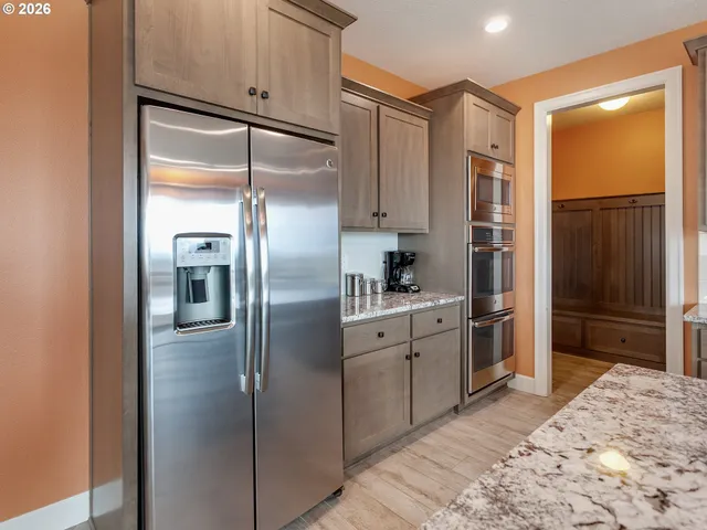 a kitchen with a refrigerator and a refrigerator