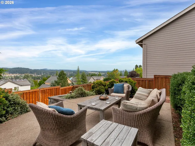 a balcony with furniture and city view