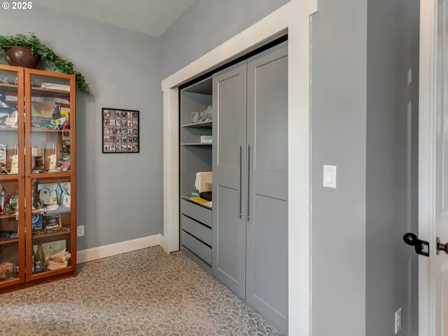 a view of room with cabinet and closet