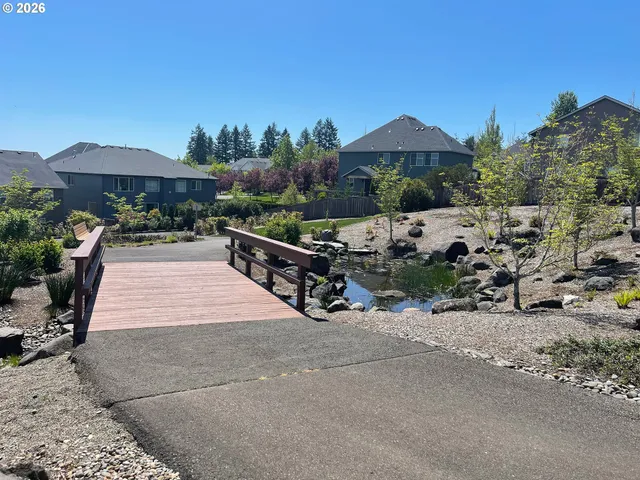 a view of a patio with a table under an umbrella