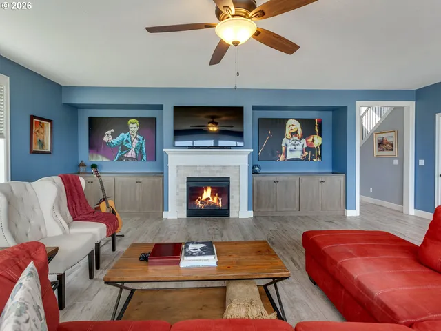 a living room with furniture fireplace and a flat screen tv