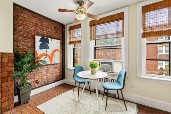 a workspace with furniture and a window