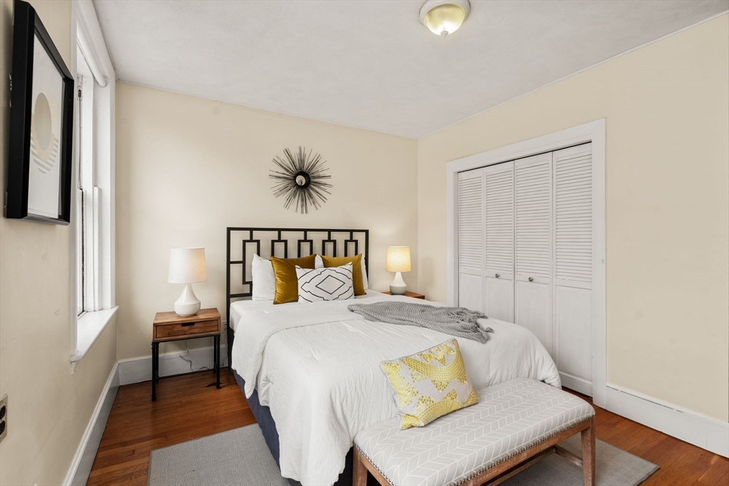 37 St Paul Street, Unit 3 Brookline, MA 02446 - Photo 8 of 13 a bedroom with a bed and a window