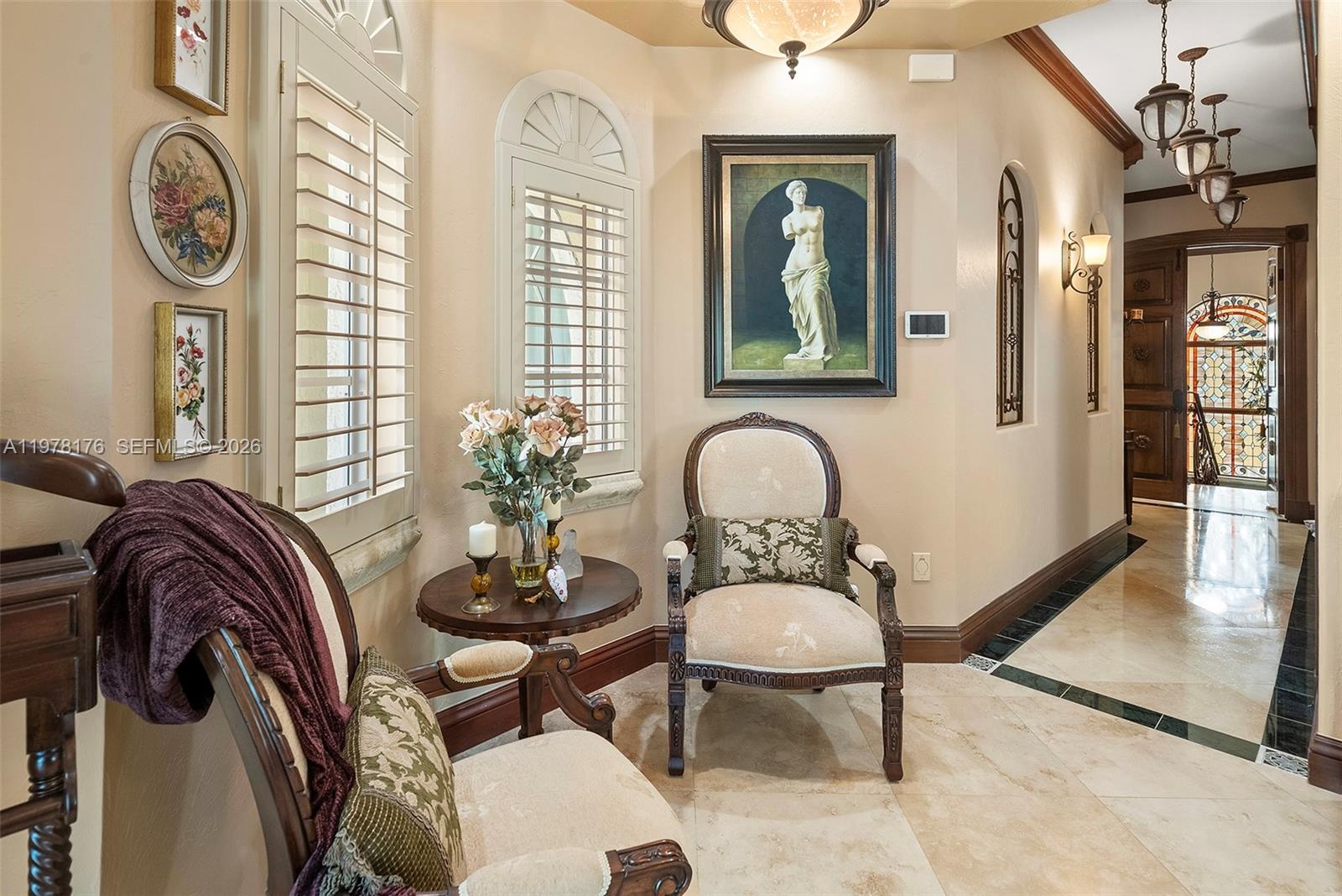 4501 North Bay Road Miami Beach, FL 33140 - Photo 11 of 24 a living room with furniture and a window