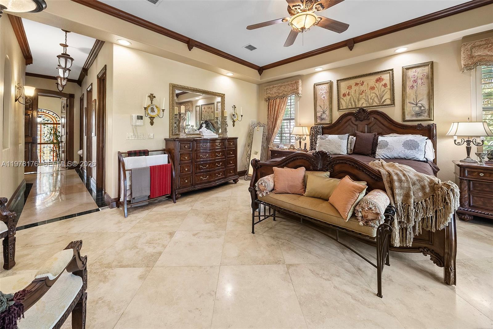 4501 North Bay Road Miami Beach, FL 33140 - Photo 12 of 24 a bed room with a bed and a chandelier