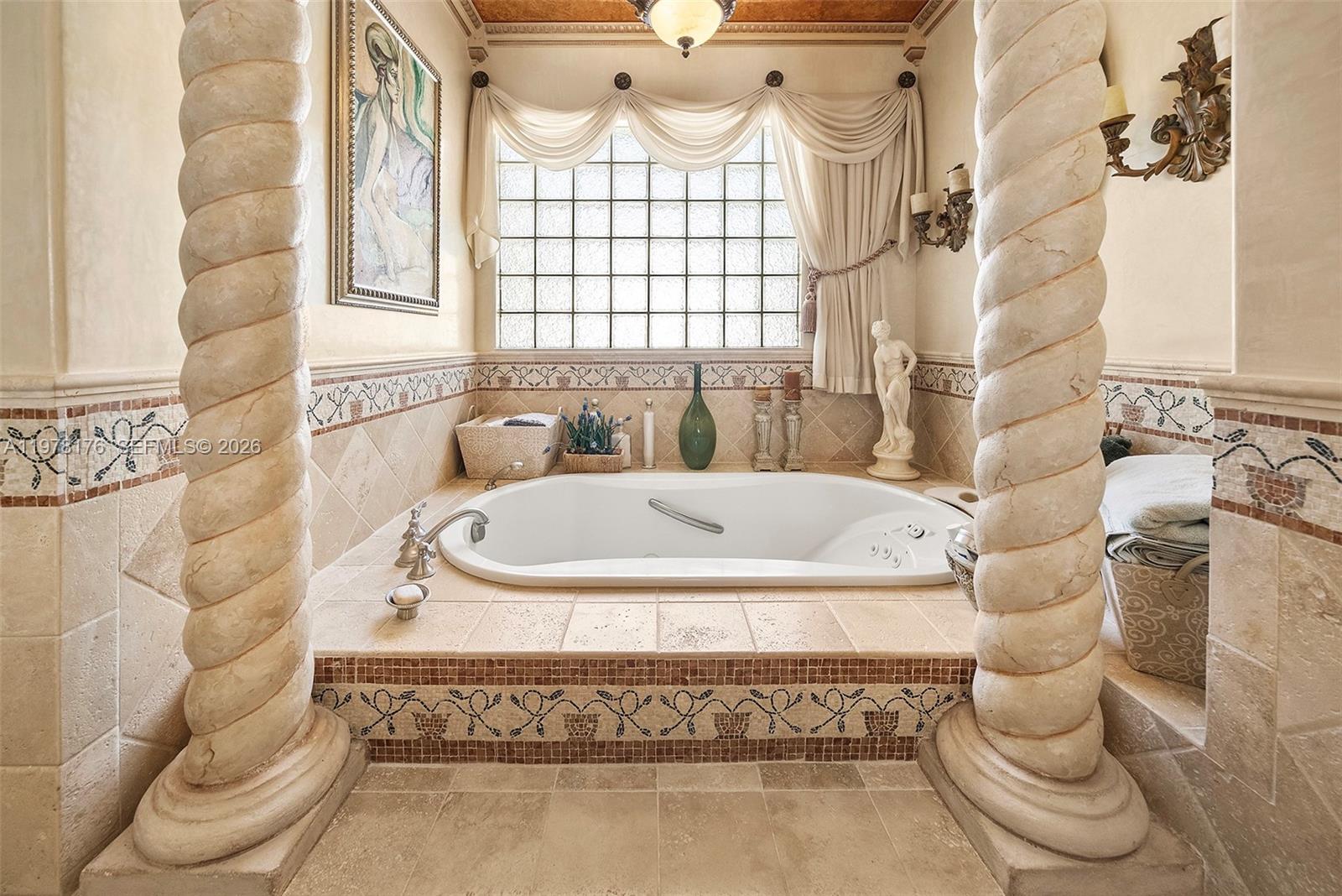 4501 North Bay Road Miami Beach, FL 33140 - Photo 15 of 24 a bathroom with a sink and a mirror