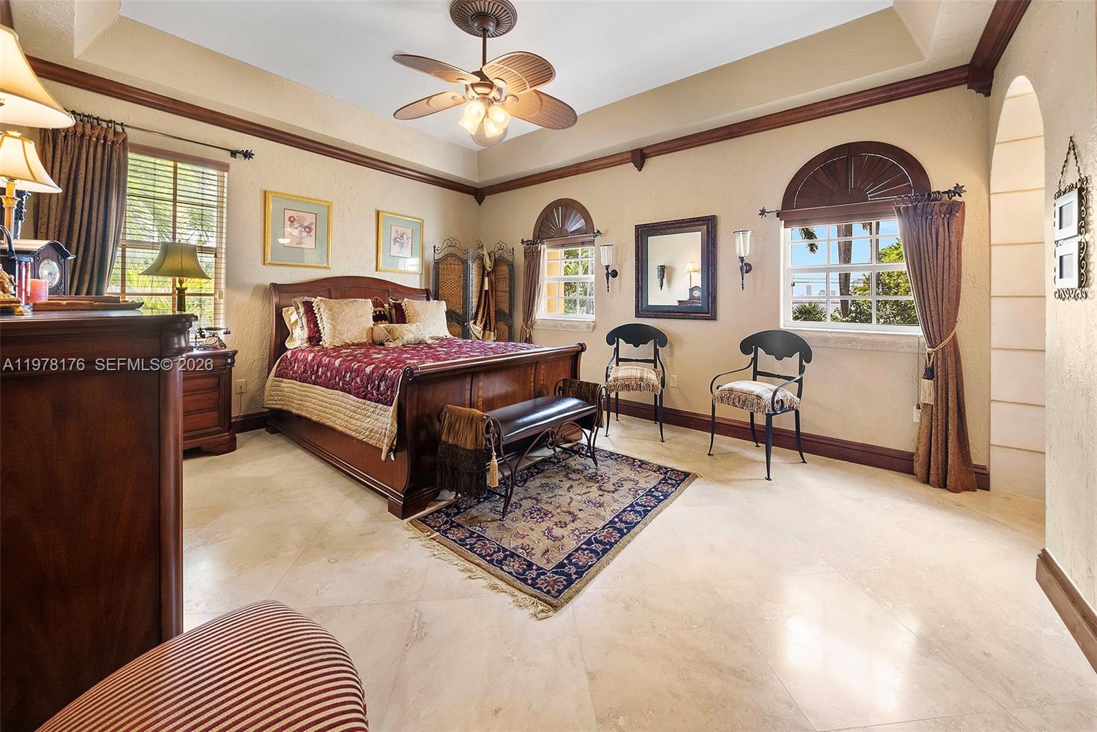 4501 North Bay Road Miami Beach, FL 33140 - Photo 20 of 24 a living room with furniture a rug and a chandelier