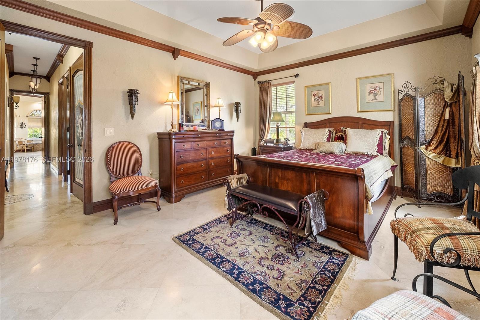 4501 North Bay Road Miami Beach, FL 33140 - Photo 21 of 24 a bedroom with furniture and a window